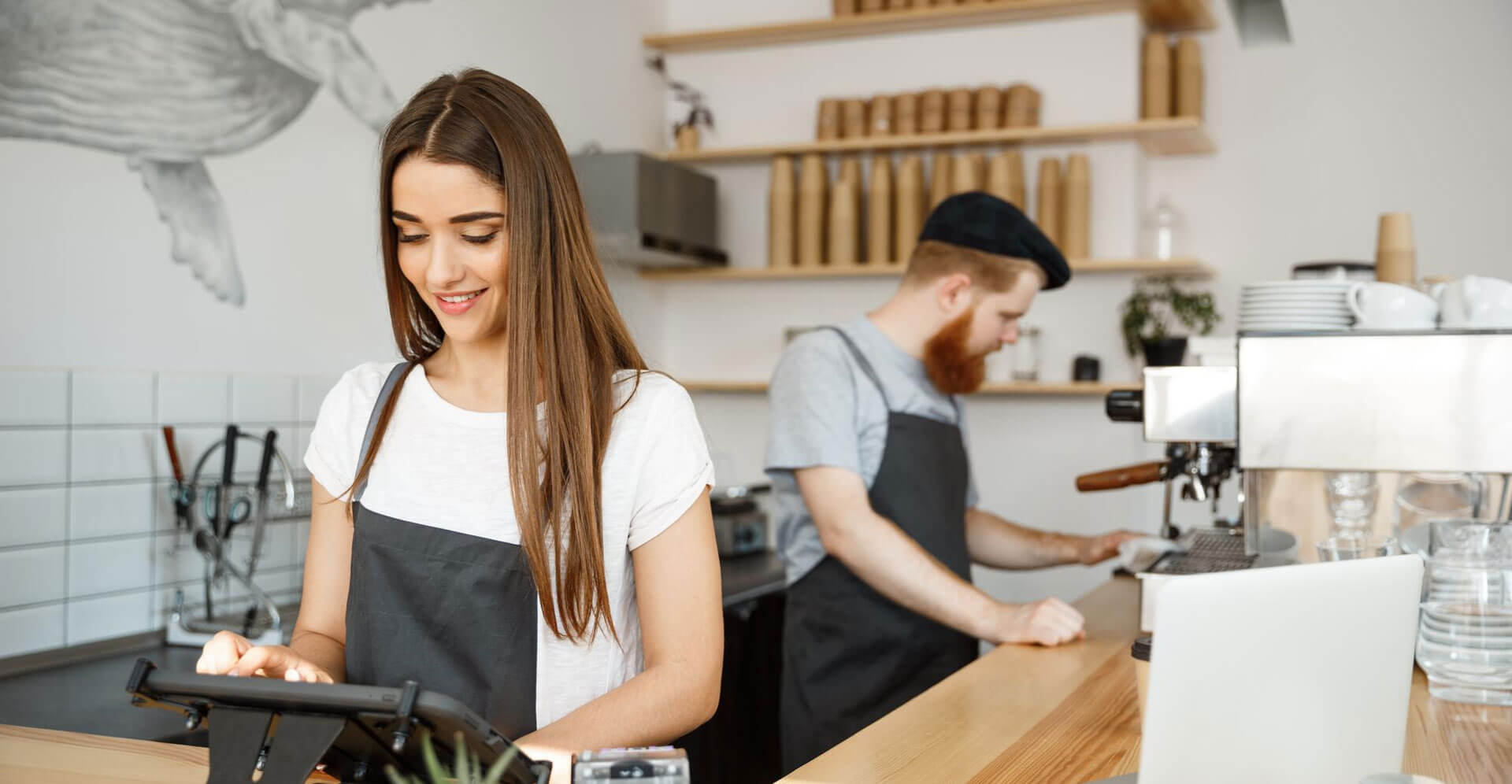 Employees working happily in a cafe